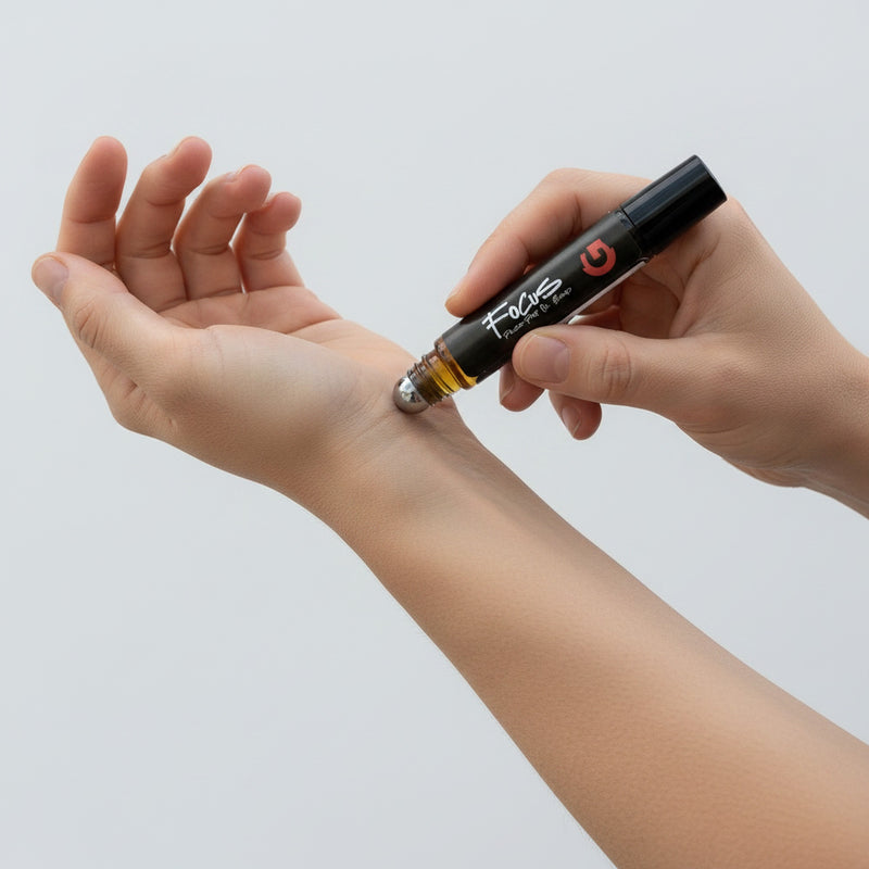 Rolling GOGHINI Focus Oil onto the inner wrist pulse point, selective colour