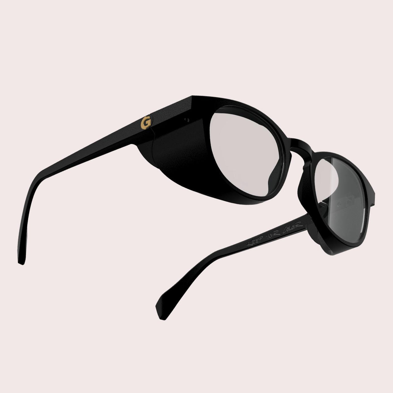 GOGHINI Focus Frames™ shown from three-quarter rear perspective, showing black frames with integrated side shields that block peripheral vision, featuring a yellow 'G' logo on the temple