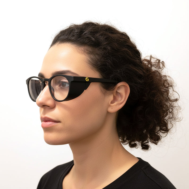 Woman wearing GOGHINI Focus Frames™ in profile, showing the peripheral-blocking side shield in use