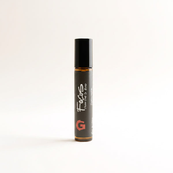 GOGHINI Focus Oil pulse-point roll-on pen standing upright, black label with white FOCUS script and red G