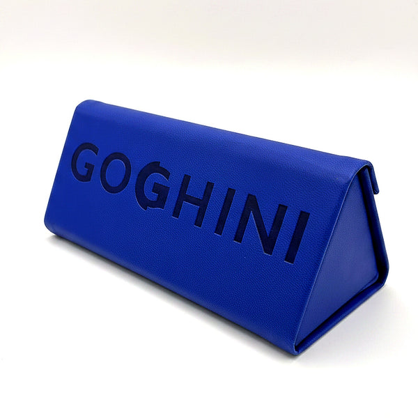 Cobalt blue GOGHINI fold-up glasses case standing, debossed GOGHINI wordmark on the side panel