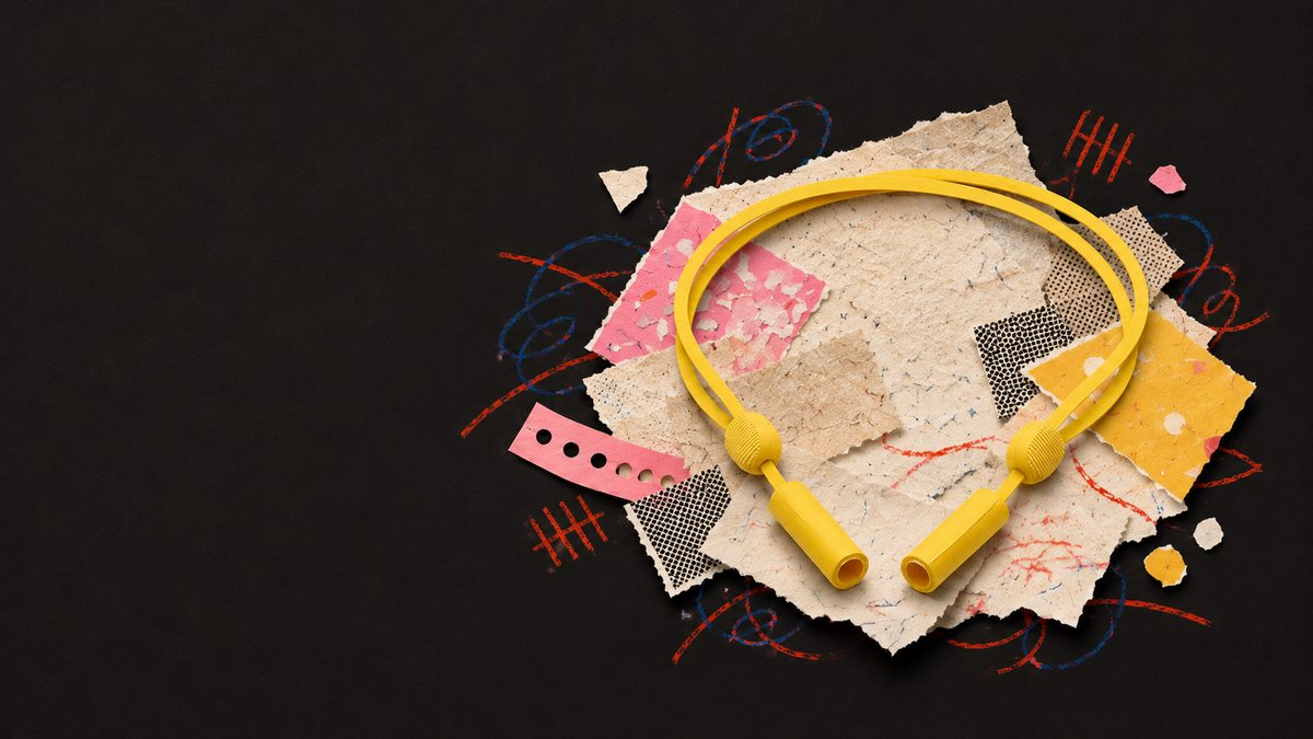 Paper illustration of the yellow glasses retainer, showing its two toggles and attachment sleeves.