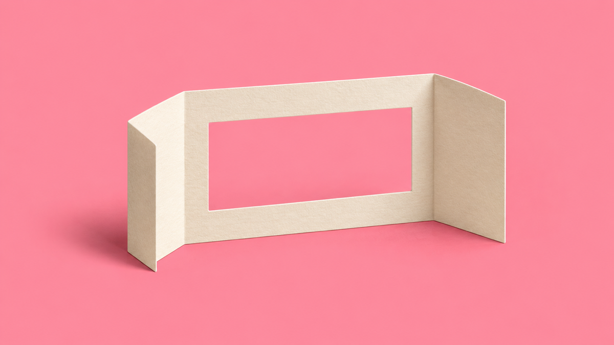 Cream paper window with folded side panels on a pink background